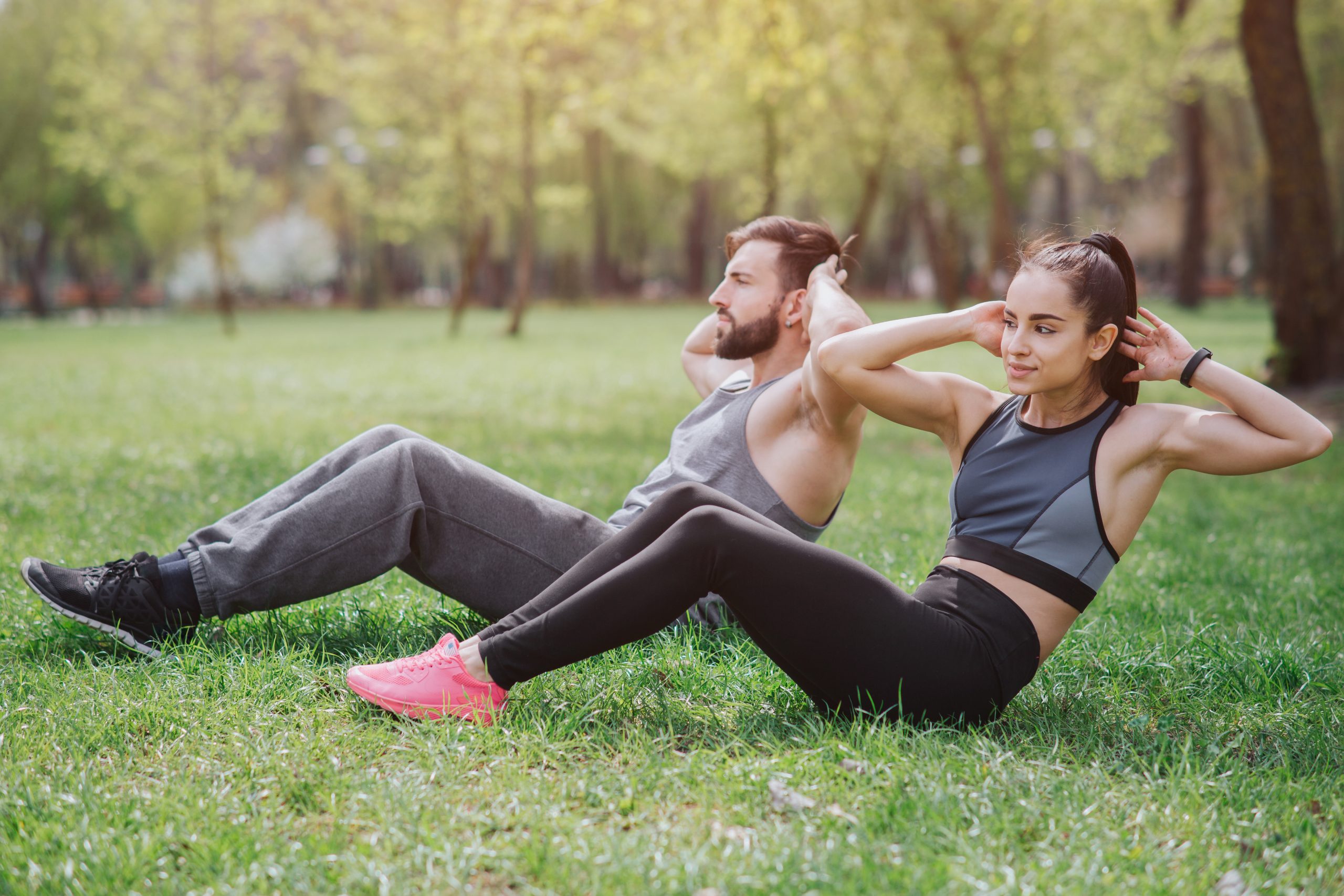 Strong And Powerful People Are Working Out Outside In Park They Are