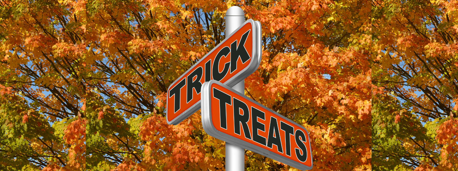 A street sign with "Trick" and "Treats" in bold letters stands against a vibrant backdrop of autumn leaves, conveying a playful Halloween theme.