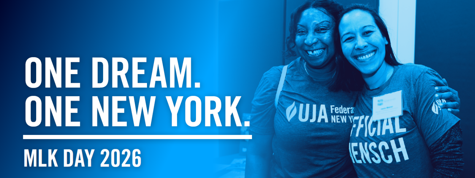 Two people in matching shirts smile warmly. Text reads "One Dream. One New York. MLK Day 2026." The image conveys unity and celebration.